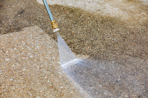 Pressure washing pavement