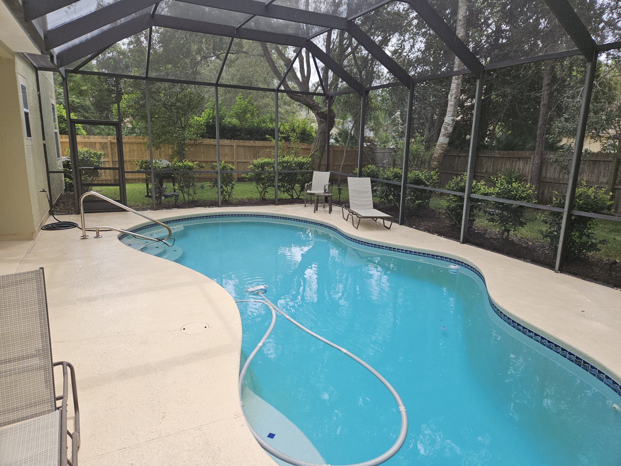 Pool enclosure and pool deck after pressure washing in St. Augustine, Fl.